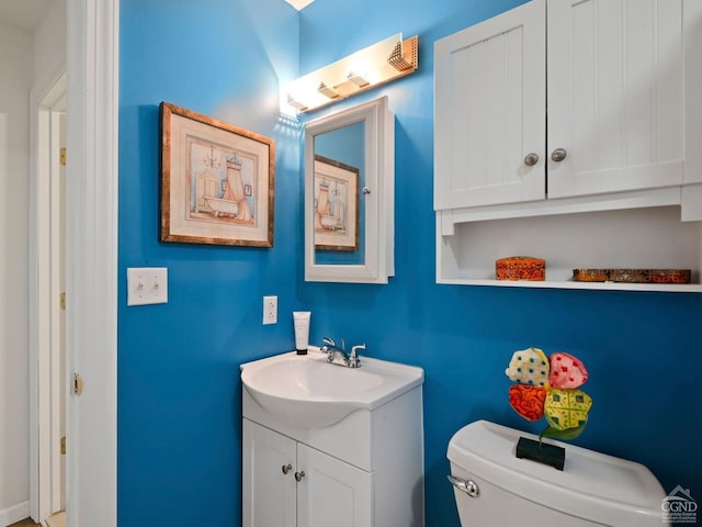 bathroom with vanity and toilet