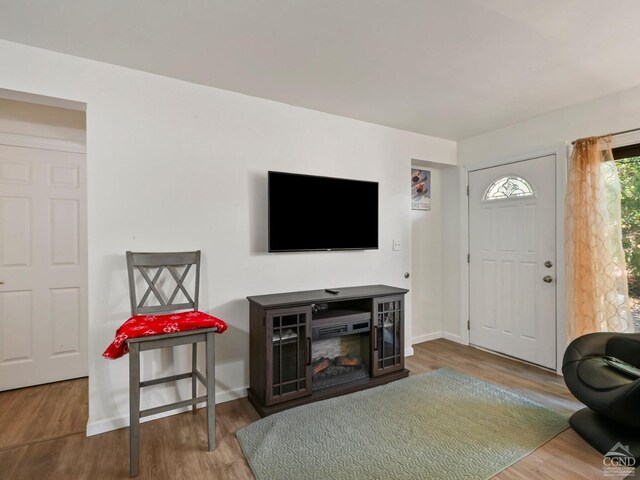 kitchen with decorative backsplash, dark hardwood / wood-style flooring, white appliances, sink, and white cabinetry