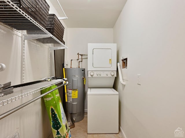 clothes washing area featuring water heater and stacked washer and dryer