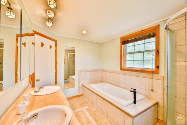 bathroom featuring tile patterned flooring, vanity, and independent shower and bath