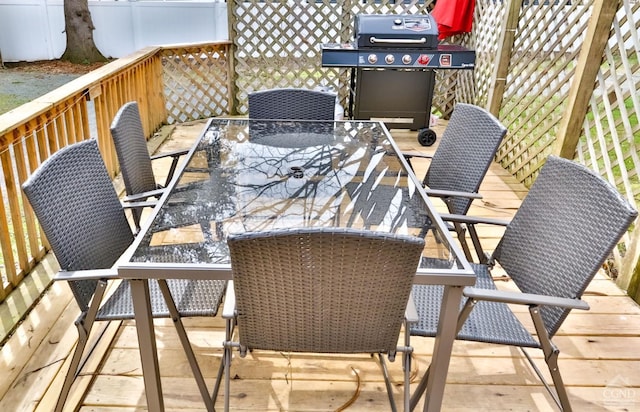 wooden balcony with area for grilling and a deck