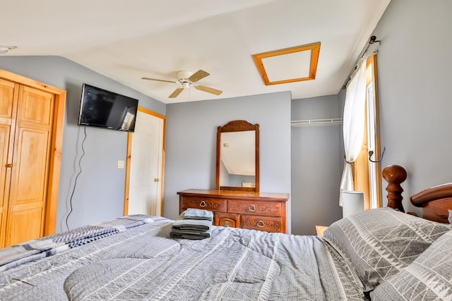 bedroom with ceiling fan, vaulted ceiling, and a closet