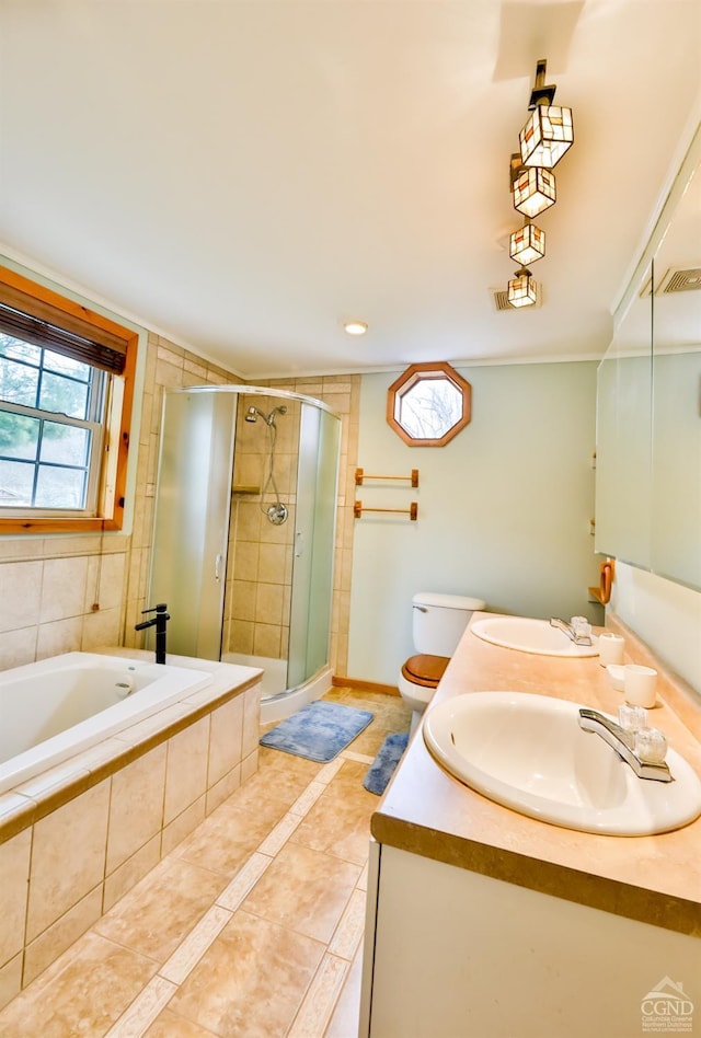 full bathroom featuring tile patterned floors, toilet, vanity, and shower with separate bathtub