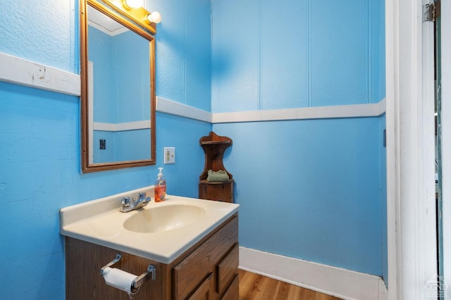 bathroom with wood-type flooring and vanity