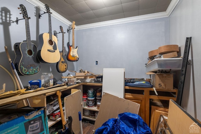 misc room with hardwood / wood-style floors and ornamental molding