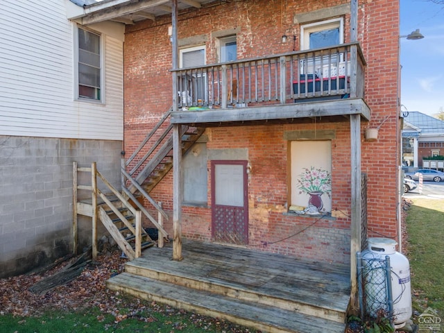 back of house featuring a balcony