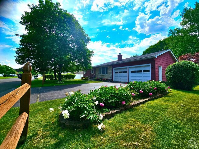 view of side of property featuring a yard and a patio