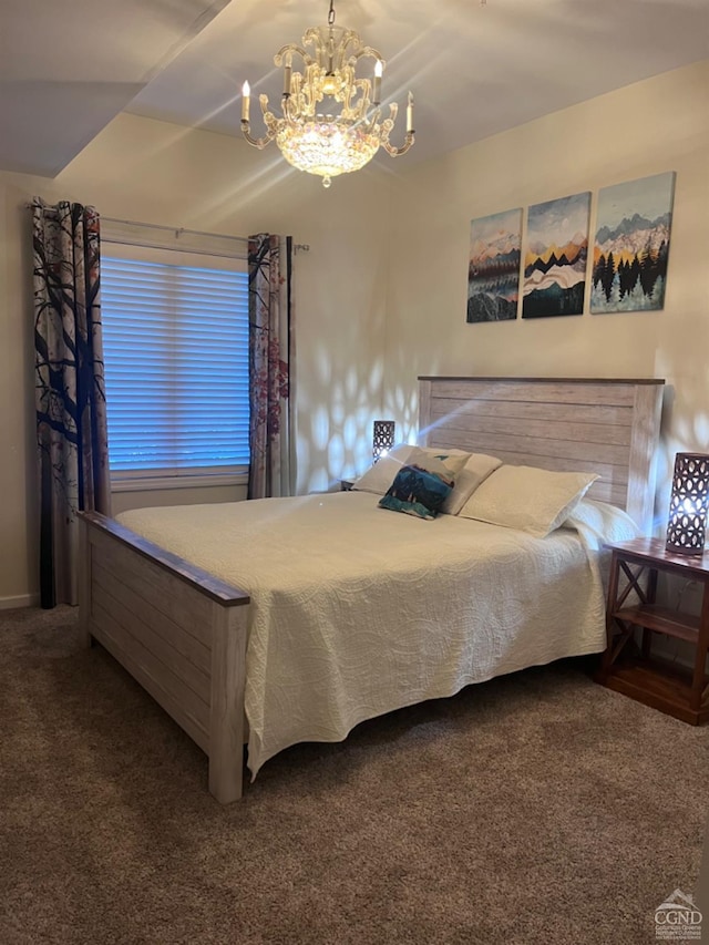 carpeted bedroom with a notable chandelier