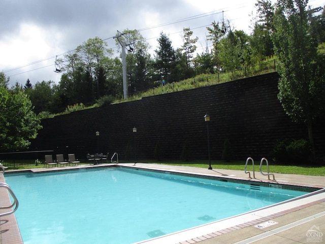 community pool with fence