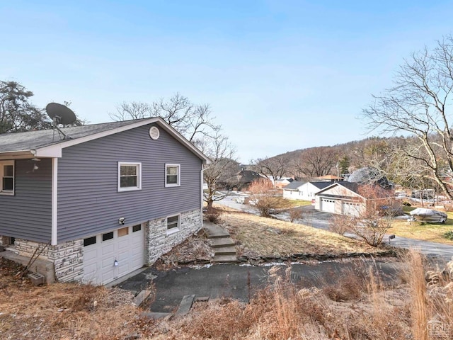 view of property exterior featuring a garage