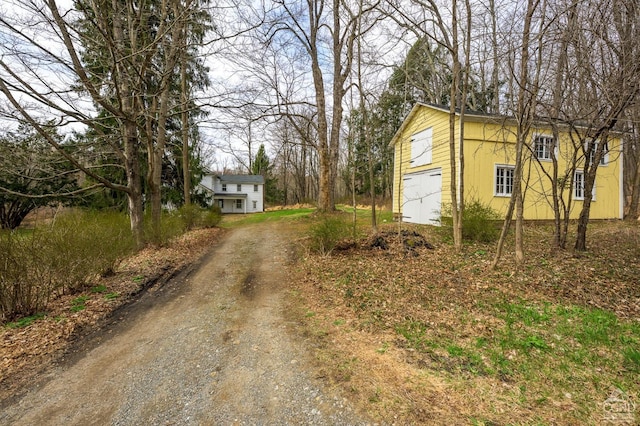 view of street featuring dirt driveway