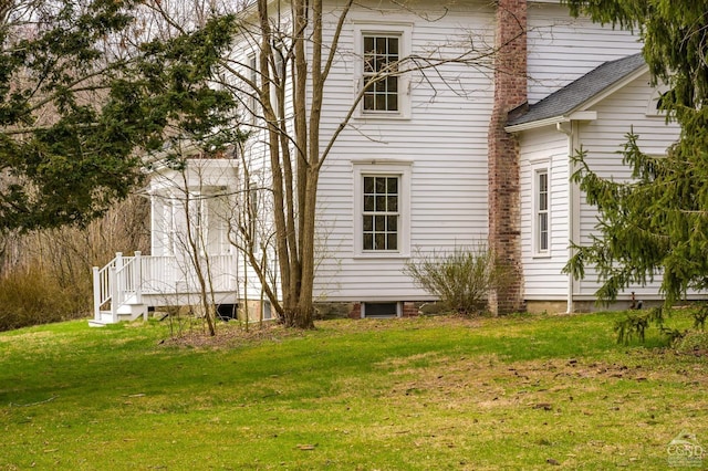 back of property with a yard