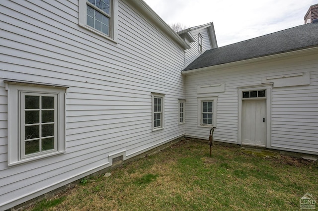 rear view of house with a lawn