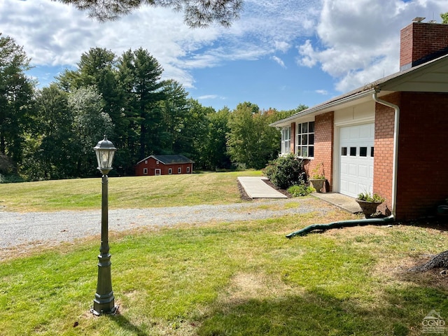 view of yard featuring an attached garage