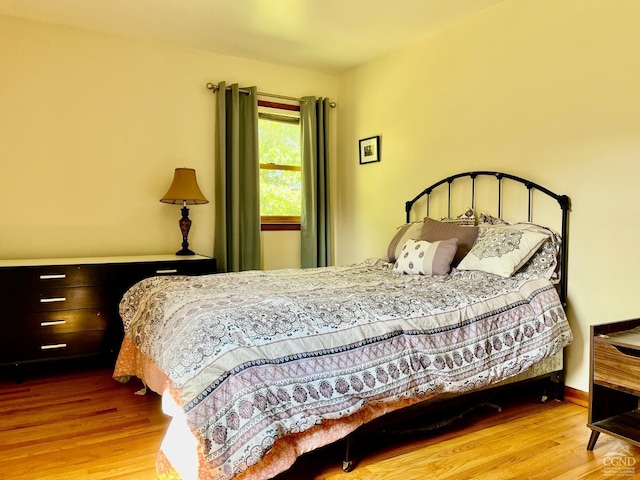 bedroom with wood finished floors