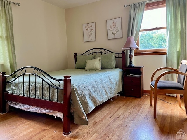 bedroom with wood finished floors