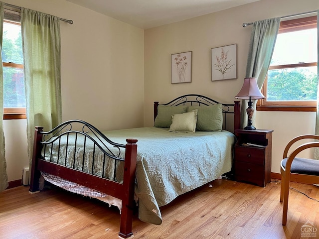 bedroom featuring wood finished floors