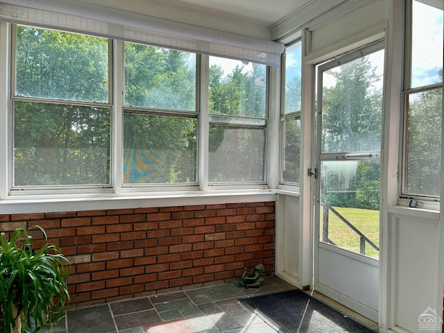 unfurnished sunroom with a wealth of natural light