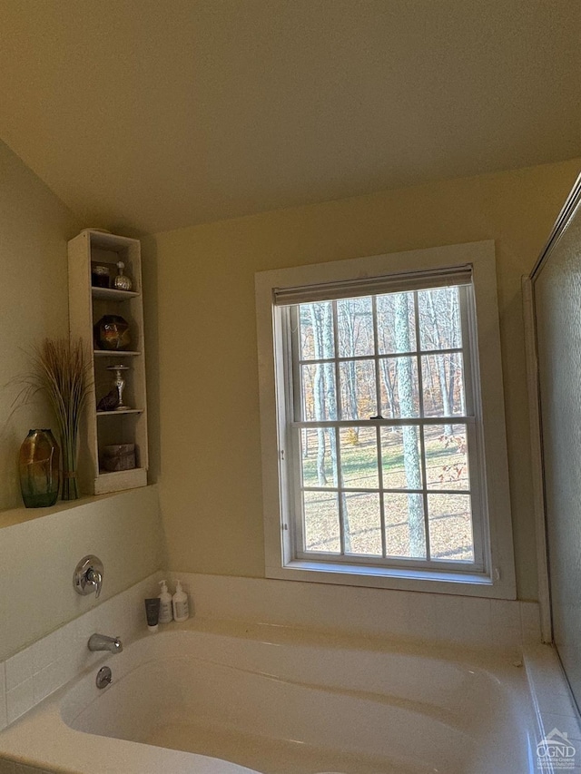 bathroom featuring a tub