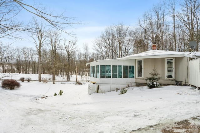 view of front of house with a sunroom