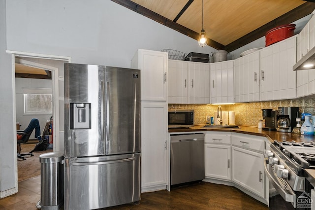 kitchen with white cabinetry, pendant lighting, stainless steel appliances, and sink