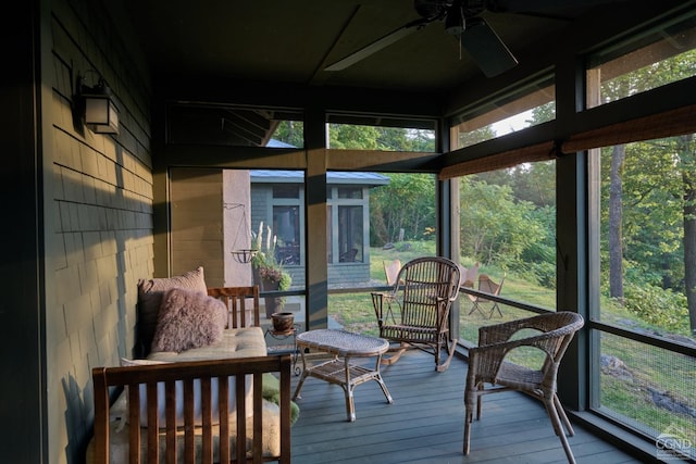 sunroom / solarium featuring ceiling fan