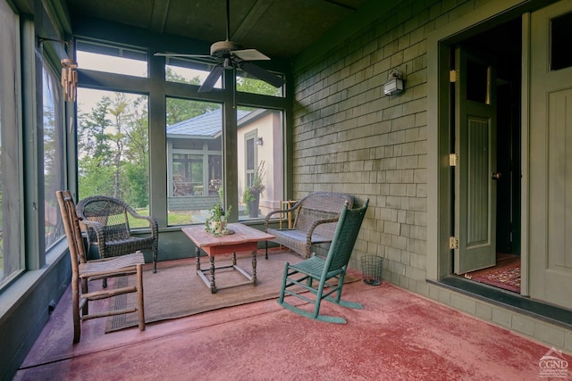 sunroom with ceiling fan and a healthy amount of sunlight