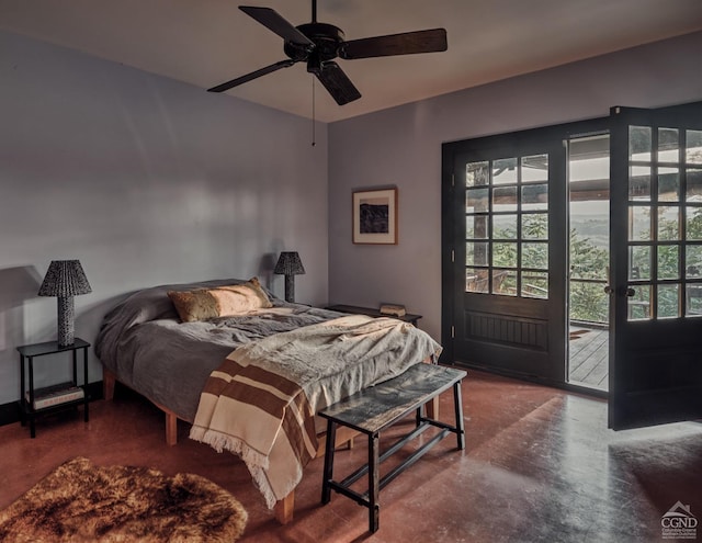 bedroom with access to exterior, concrete floors, and ceiling fan