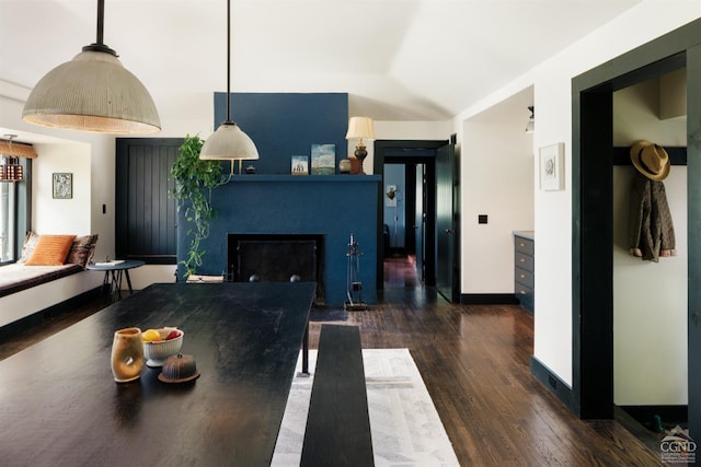 dining area featuring dark wood-type flooring
