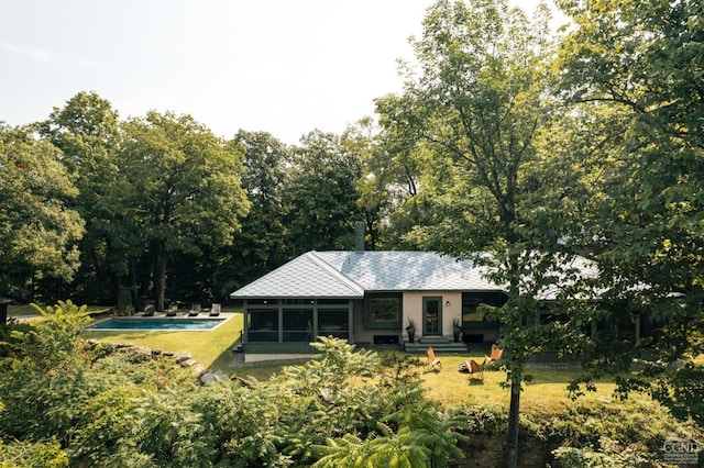 back of house with a sunroom
