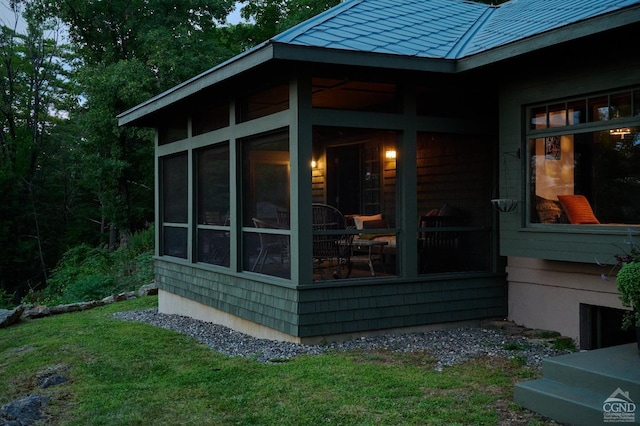 view of side of property with a sunroom