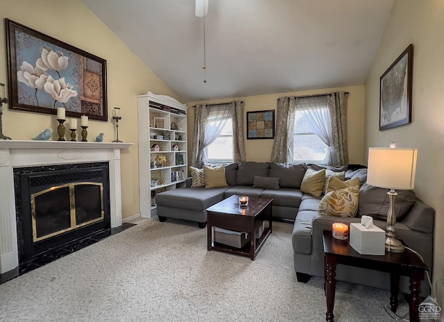 living room featuring a fireplace, carpet floors, and lofted ceiling