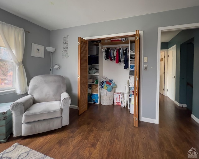 sitting room with dark hardwood / wood-style floors