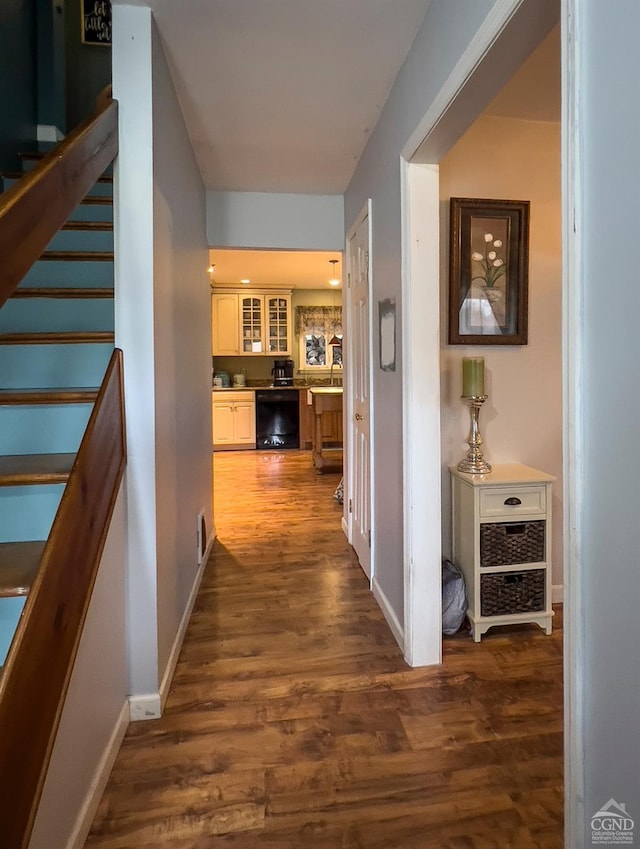 corridor featuring dark hardwood / wood-style flooring