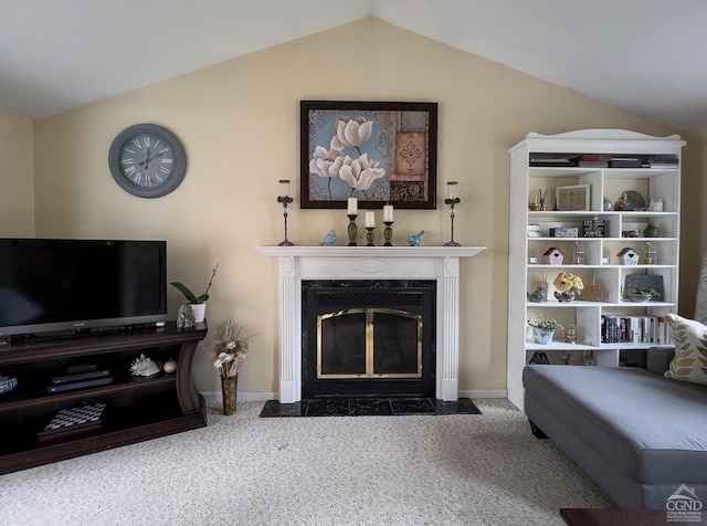 living room with a high end fireplace, dark carpet, and lofted ceiling