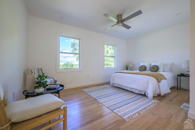 bedroom featuring ceiling fan and light hardwood / wood-style floors