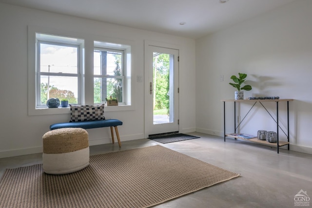 doorway to outside featuring concrete flooring