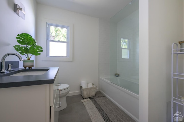 full bathroom featuring toilet, vanity, and tiled shower / bath