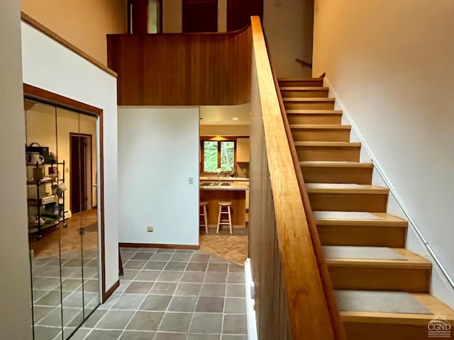 stairs featuring tile patterned flooring