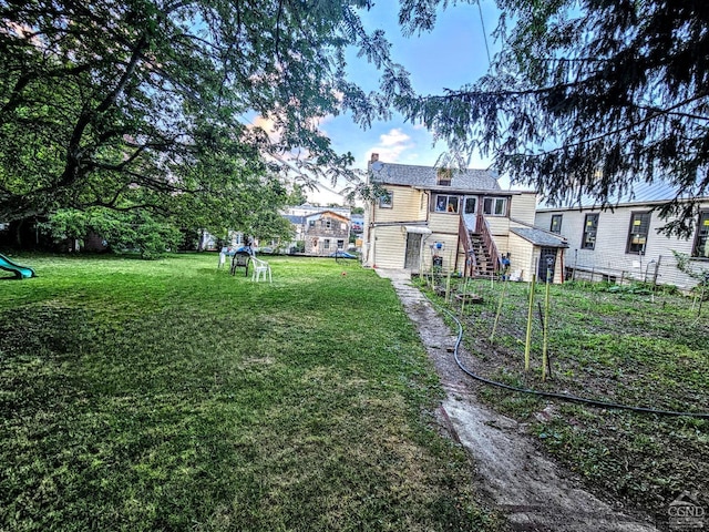 view of yard featuring stairway