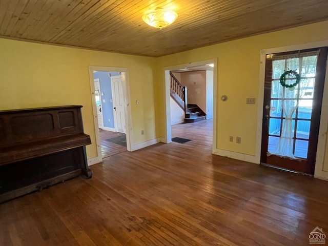 entrance foyer featuring hardwood / wood-style flooring and wood ceiling