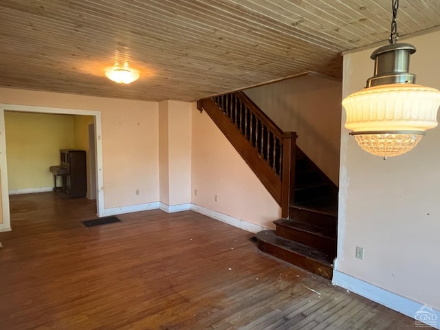 stairs with hardwood / wood-style floors