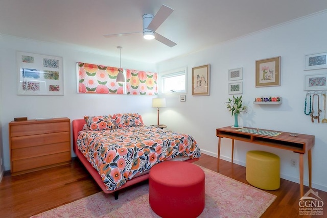bedroom with ceiling fan and wood finished floors