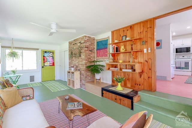 living room with visible vents and ceiling fan