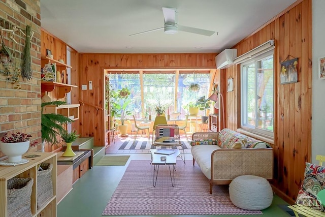 sunroom / solarium featuring wooden walls and an AC wall unit