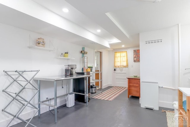 interior space with recessed lighting, baseboards, and concrete floors
