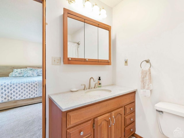 bathroom with vanity and toilet