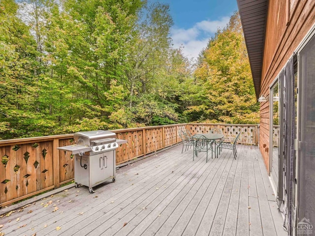 wooden deck with grilling area