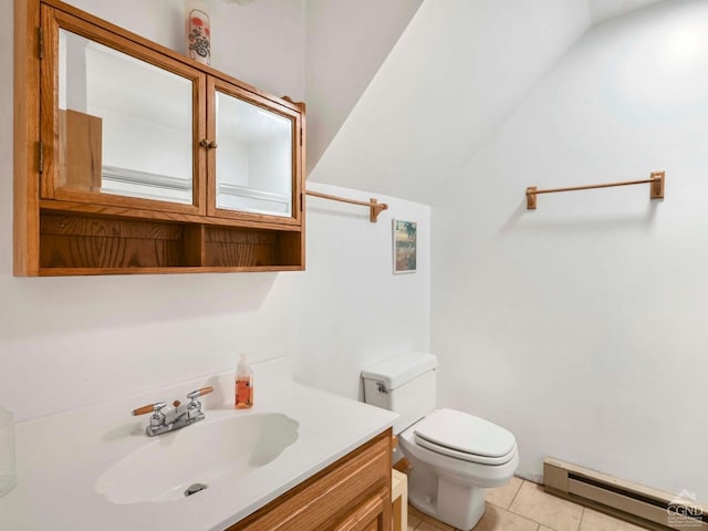 bathroom with tile patterned floors, vanity, toilet, and a baseboard heating unit