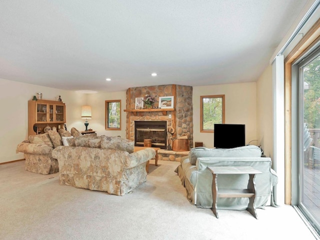 carpeted living room featuring a fireplace